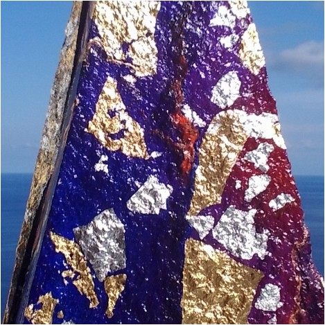 Sailing south, artwork on volcanic rock from Alicudi, Sicily, Italy. Italian artist Lucia Oliva